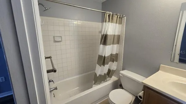 a bathroom with a toilet and a bathtub