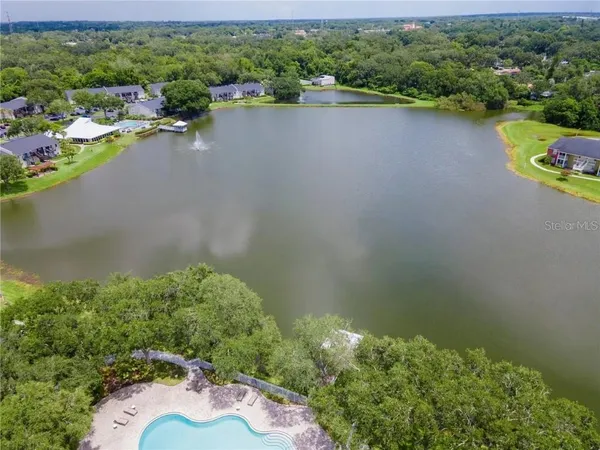 an aerial view of a house with a lake view