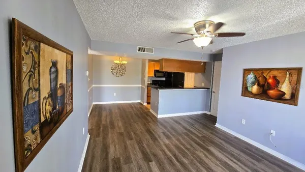 a view of a room with wooden floor and staircase