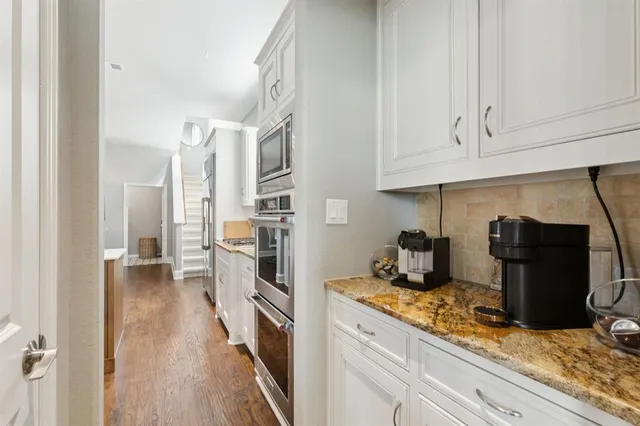 a kitchen with a sink and refrigerator