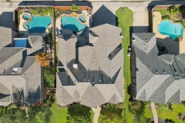 an aerial view of houses with outdoor space