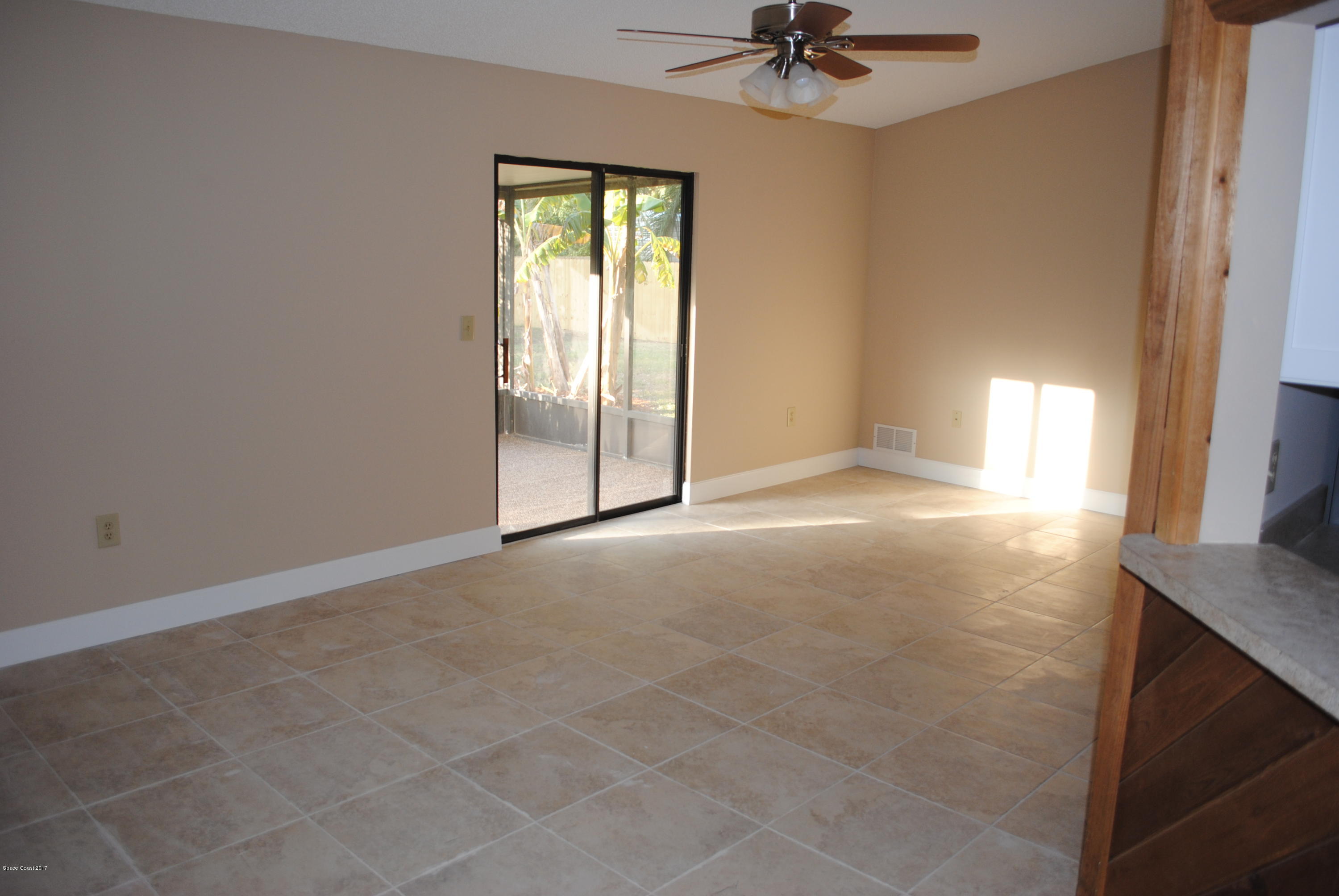 1312 Whitehurst Road Southwest Palm Bay, FL 32908 - Photo 4 of 35 a view of an empty room with a window