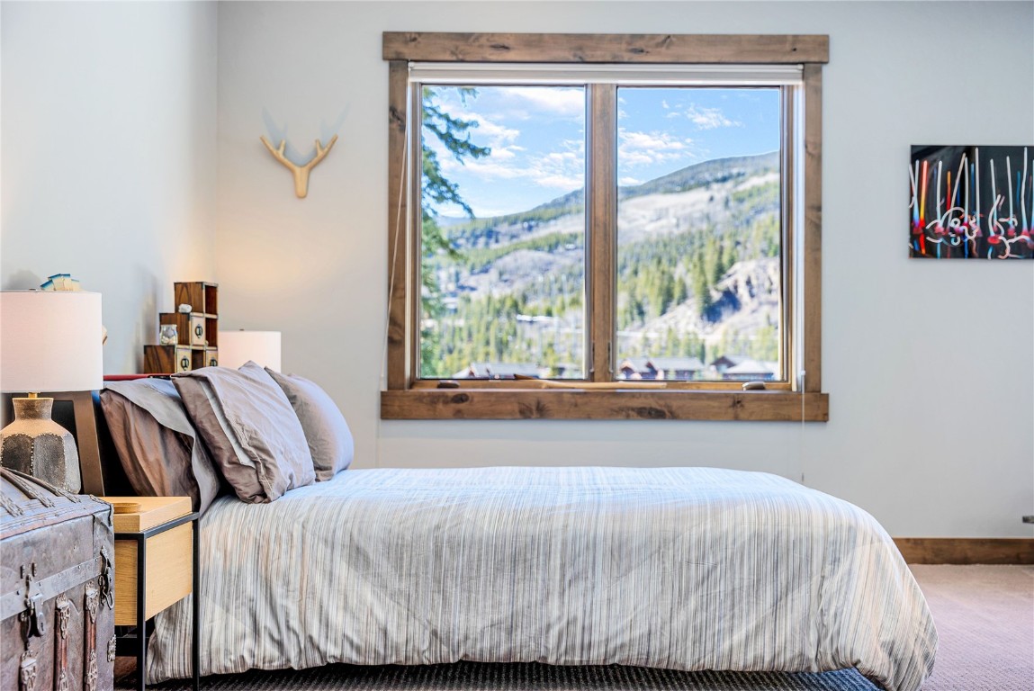 11 West Independence Road Keystone, CO 80435 - Photo 35 of 50 a bedroom with a bed and a large window