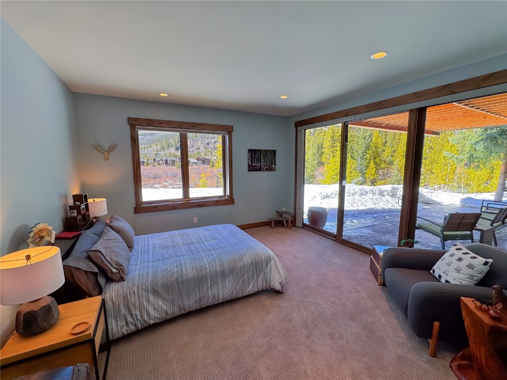 11 West Independence Road Keystone, CO 80435 - Photo 36 of 50 a bedroom with a bed and glass windows