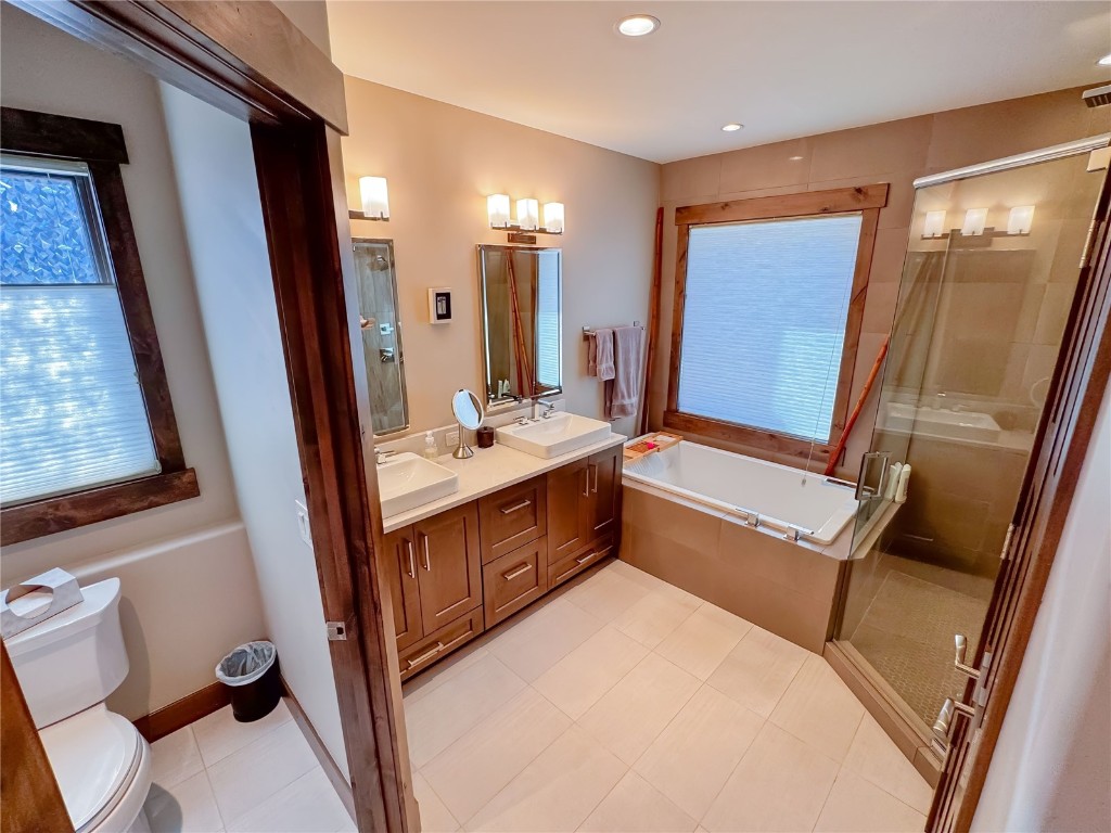 11 West Independence Road Keystone, CO 80435 - Photo 37 of 50 a bathroom with a sink a mirror and a bathtub