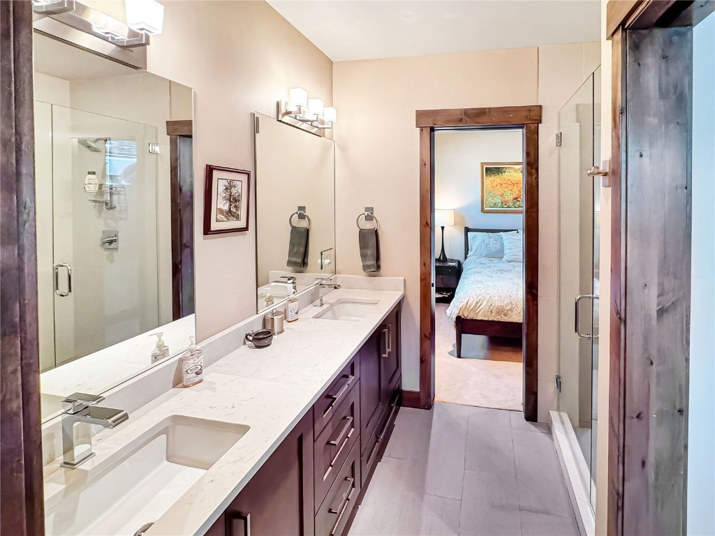 11 West Independence Road Keystone, CO 80435 - Photo 43 of 50 a en suite bathroom with a double vanity sink and a mirror