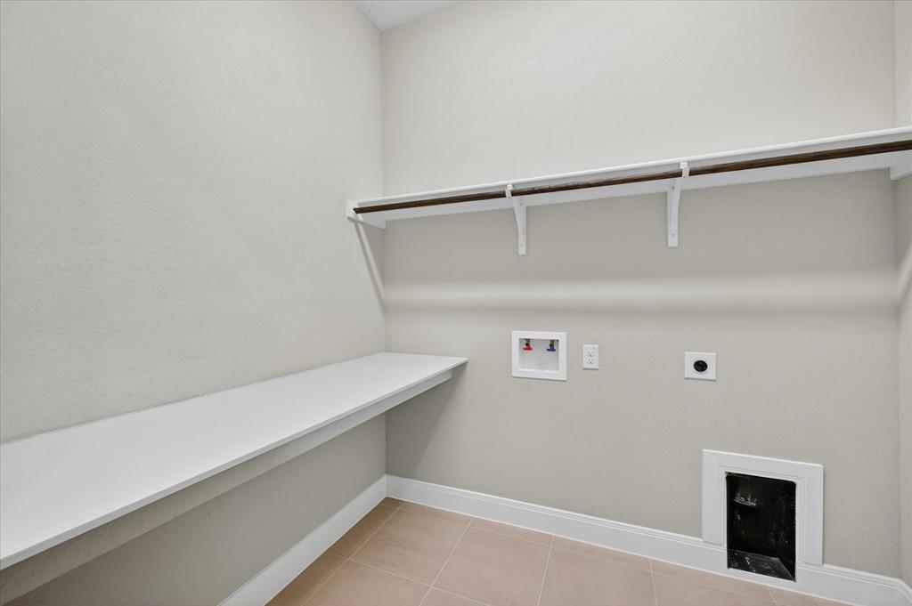 2237 Pika Road Northlake, TX 76247 - Photo 30 of 37 Laundry room with light-toned walls and tile flooring