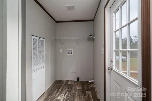 a bathroom with a granite countertop sink a mirror and shower