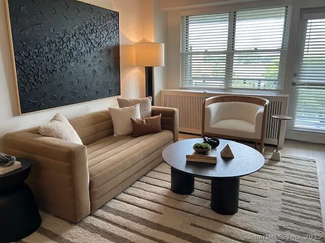 a living room with furniture and a window