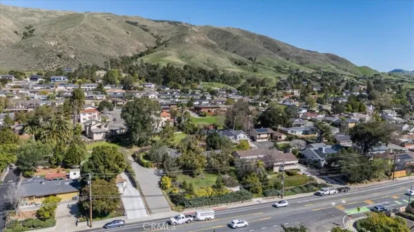 an aerial view of mountain with residential house