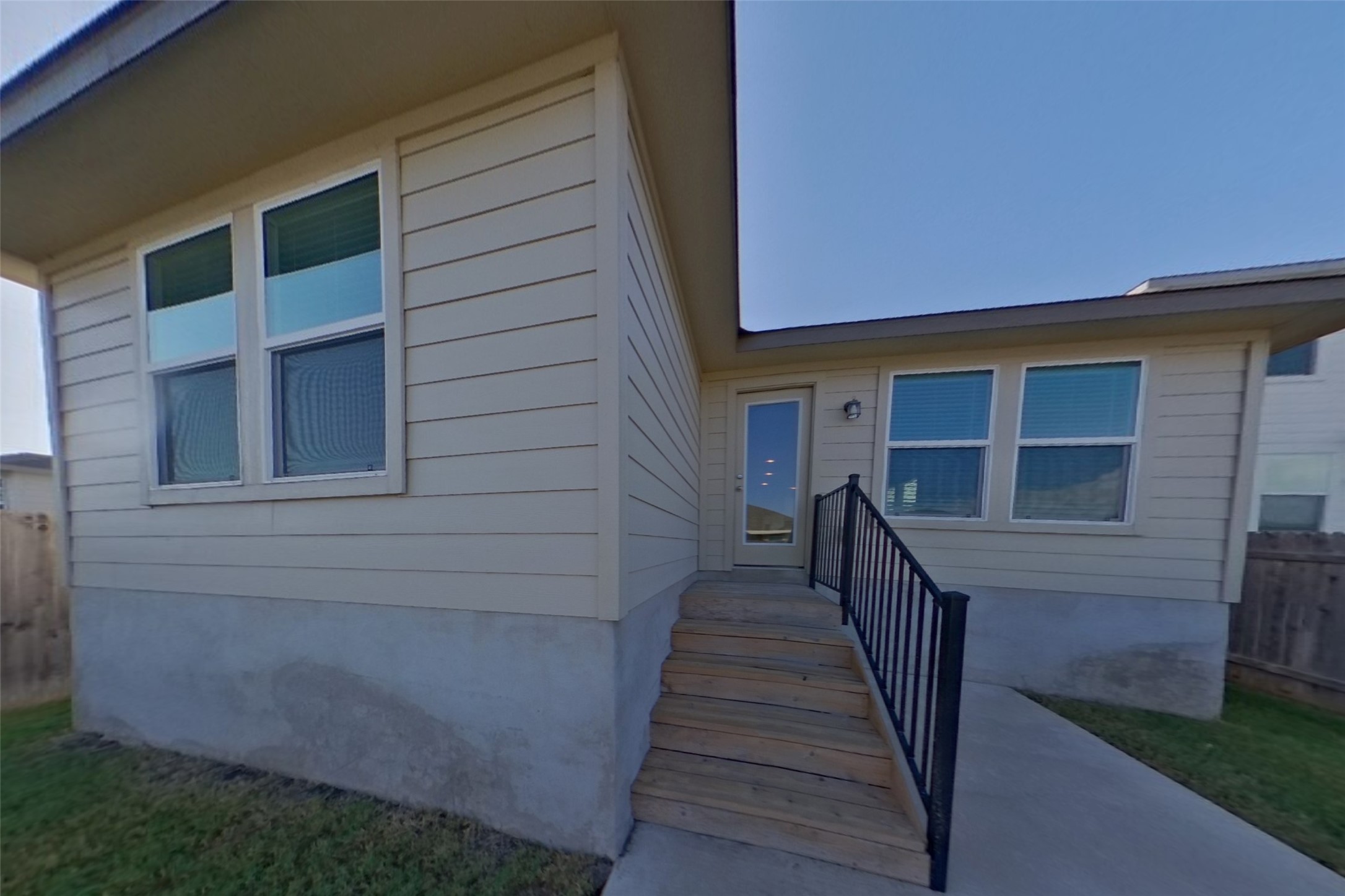 3525 Catlett Crk Road Georgetown, TX 78626 - Photo 14 of 16 Wooden steps lead up to a private side entrance with classic horizontal siding.