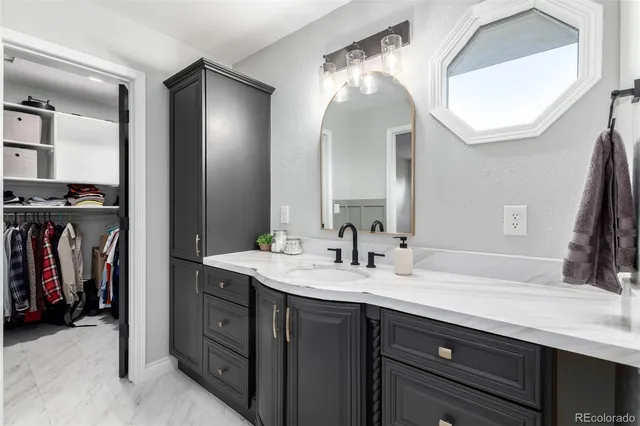 a bathroom with a double vanity sink and a mirror