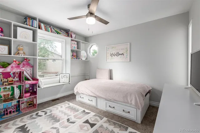 a bedroom with a bed dresser and a window