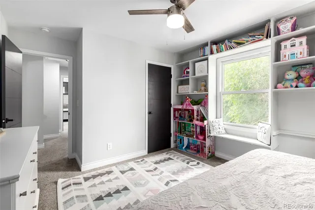 a bed room with a bed and a window