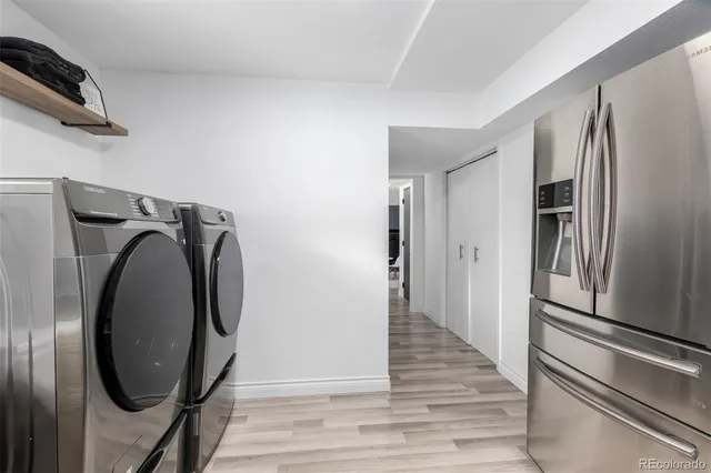 a view of a hallway with washer and dryer