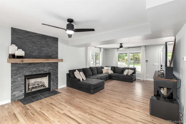 a living room with furniture and a fireplace