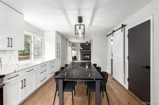 a view of kitchen with cabinets and wooden floor