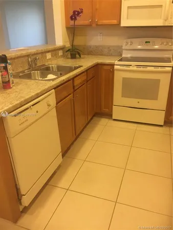 a view of a storage and utility room with washer and dryer