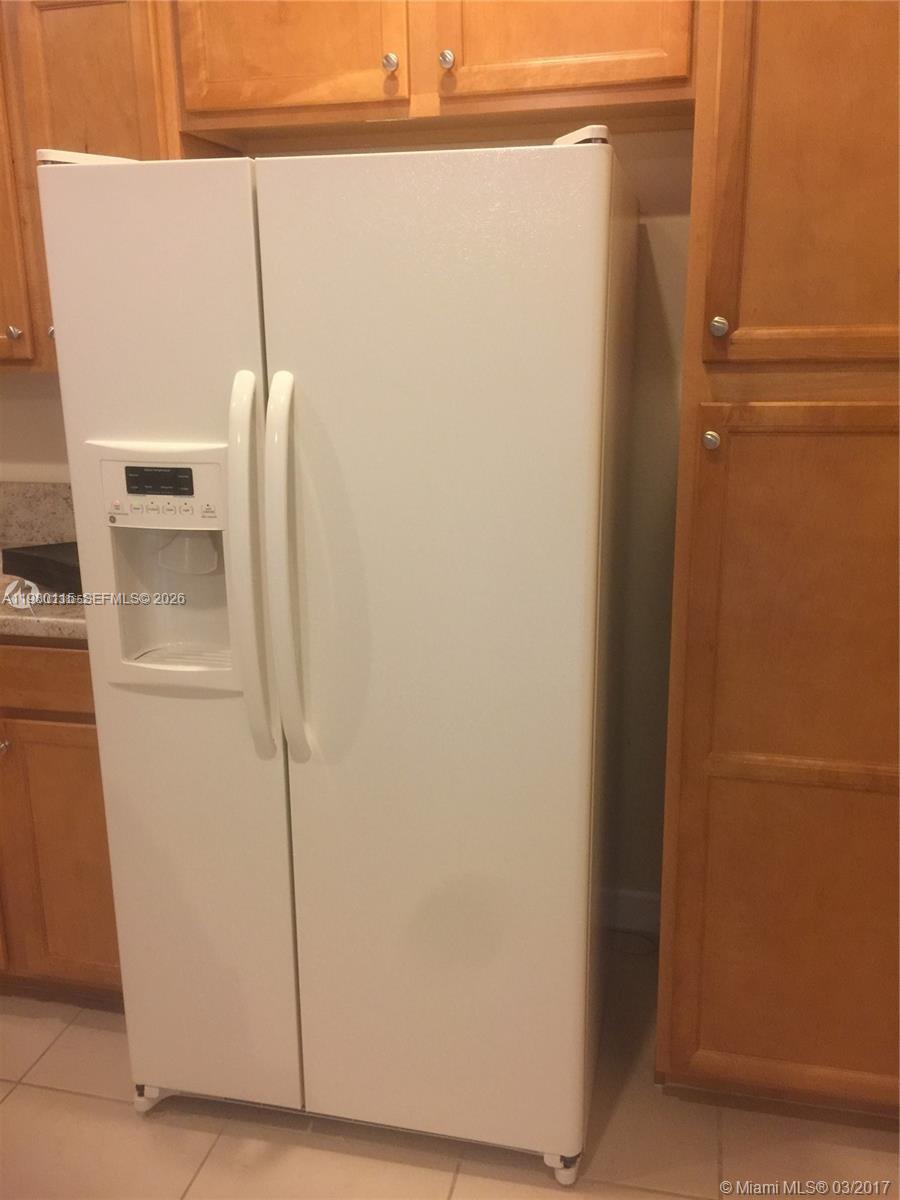 17059 Southwest 96th Street Miami, FL 33196 - Photo 9 of 22 a view of walk in closet with empty racks
