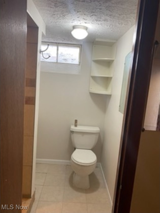 13206 Rockside Road Garfield Heights, OH 44125 - Photo 14 of 15 Bathroom with toilet and tile patterned flooring