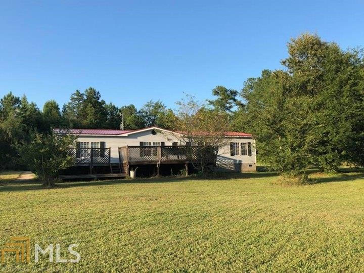 100 Smokey Hollow Road Carlton, GA 30627 - Photo 1 of 1 a front view of a house with a yard