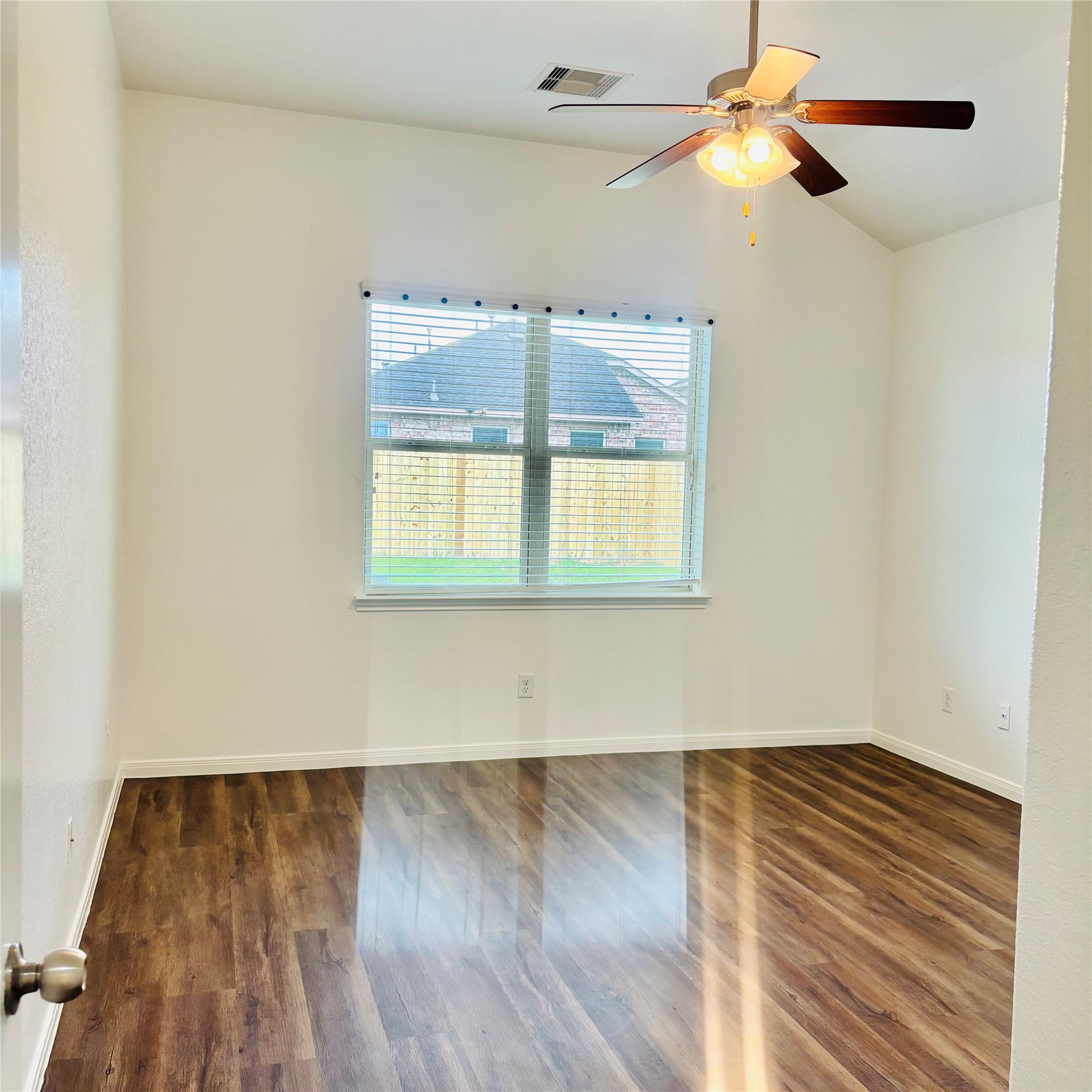 22480 Toronado Ridge Lane Porter, TX 77365 - Photo 23 of 42 an empty room with wooden floor and windows