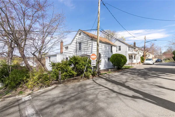 a view of a street with a building in the background