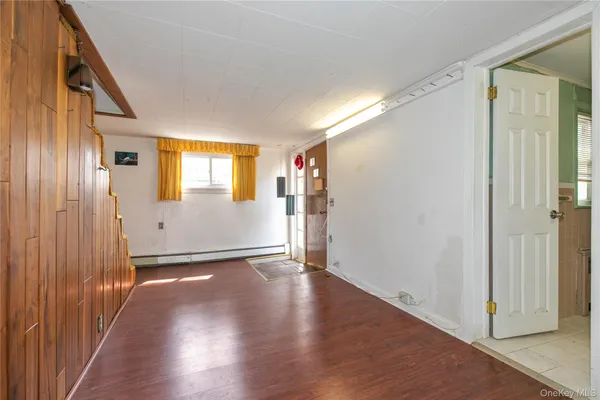 a view of a livingroom with wooden floor