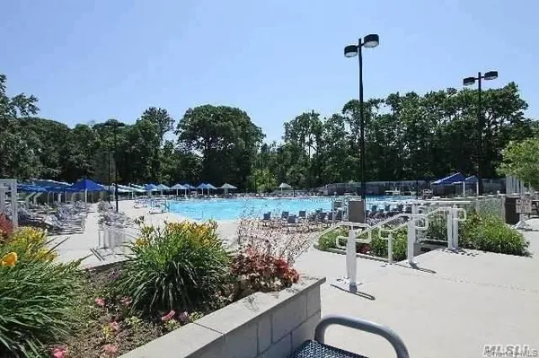 a view of a swimming pool with a patio