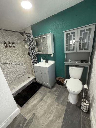 1336 Northwest 38th Street, Unit 1 Miami, FL 33142 - Photo 11 of 33 a bathroom with a sink toilet and window