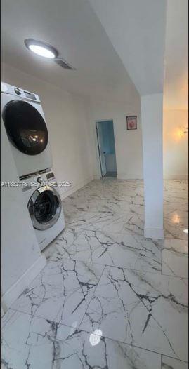 1336 Northwest 38th Street, Unit 1 Miami, FL 33142 - Photo 22 of 33 a view of entryway and washer