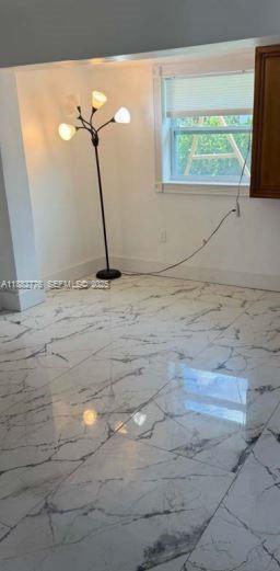 1336 Northwest 38th Street, Unit 1 Miami, FL 33142 - Photo 23 of 33 a bathroom with a sink and a window