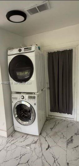 1336 Northwest 38th Street, Unit 1 Miami, FL 33142 - Photo 24 of 33 a utility room with dryer and washer
