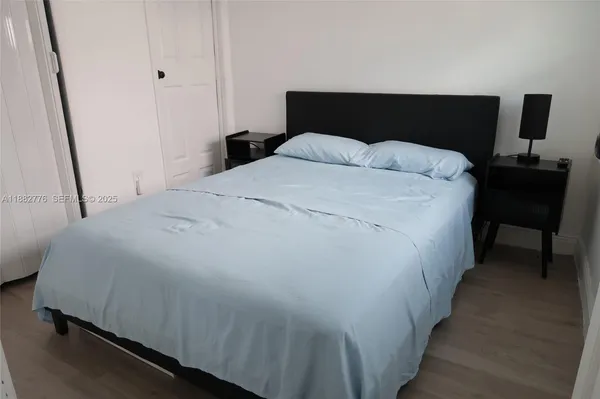 a bedroom with a bed and a table