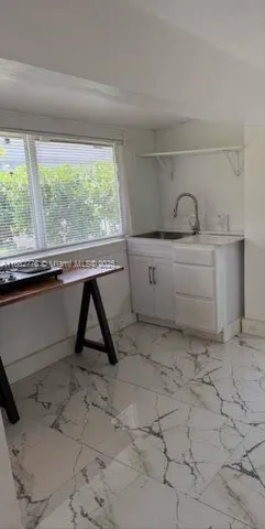 a view of a room with a window and storage