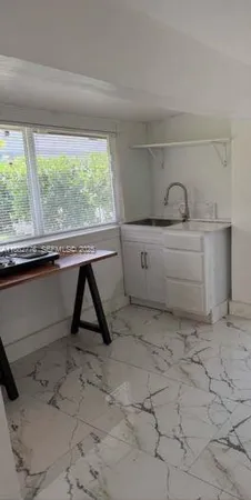 a view of a room with toys and a window