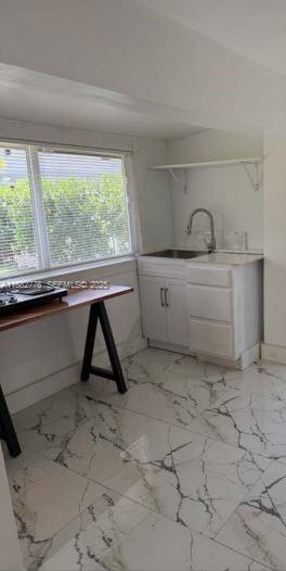 1336 Northwest 38th Street, Unit 1 Miami, FL 33142 - Photo 30 of 33 a view of a room with toys and a window