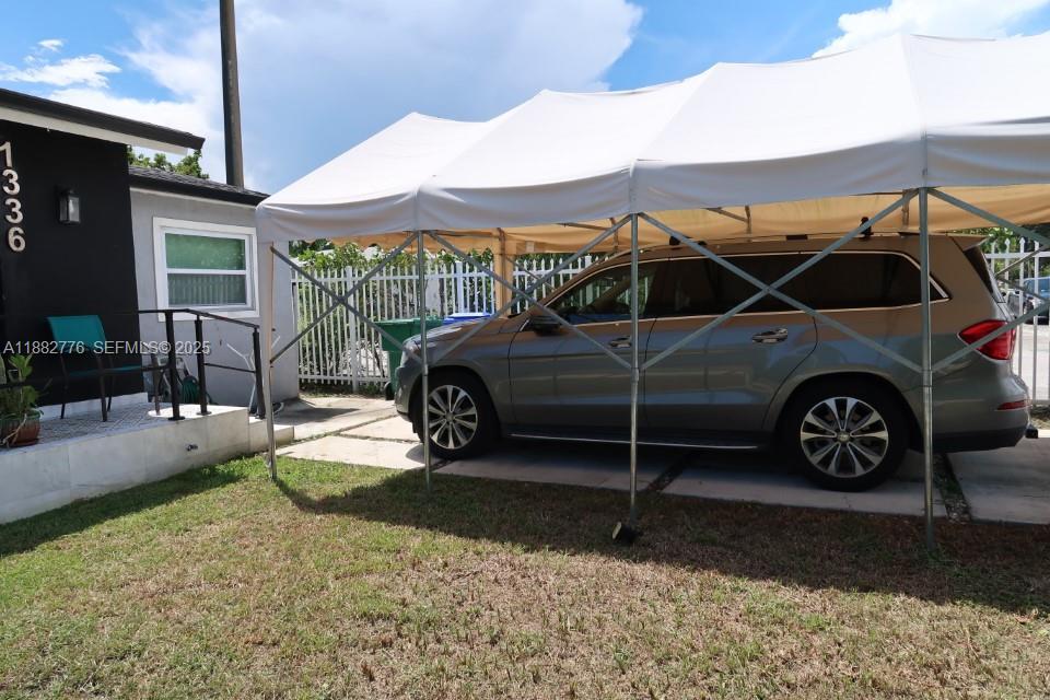 1336 Northwest 38th Street, Unit 1 Miami, FL 33142 - Photo 3 of 33 a car parked in front of a house