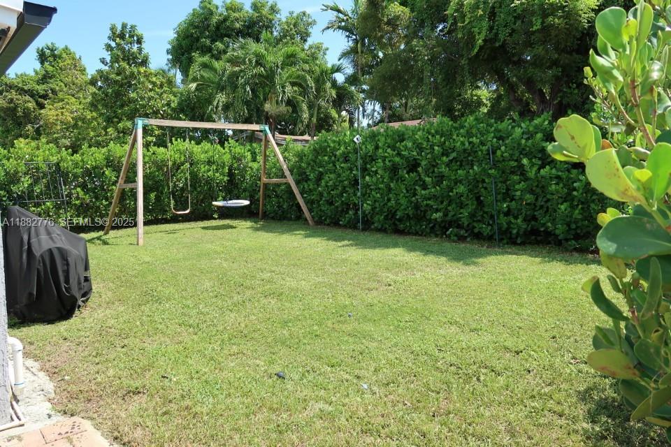 1336 Northwest 38th Street, Unit 1 Miami, FL 33142 - Photo 10 of 33 a view of a backyard with a small cabin