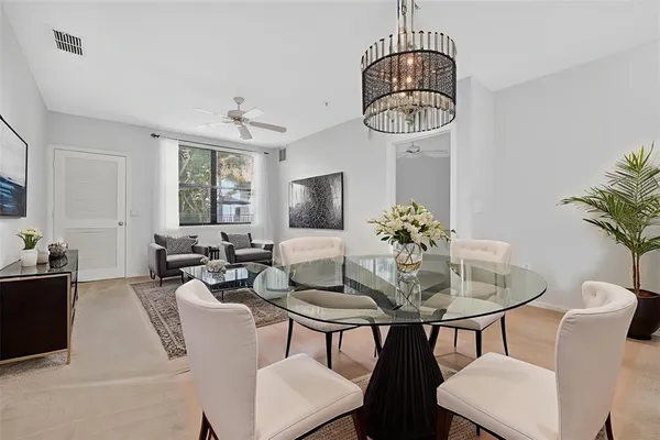 a dining room with furniture and window