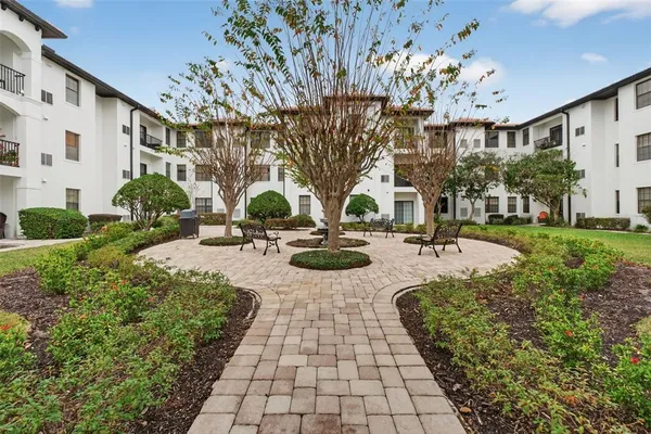a swimming pool with outdoor seating and yard