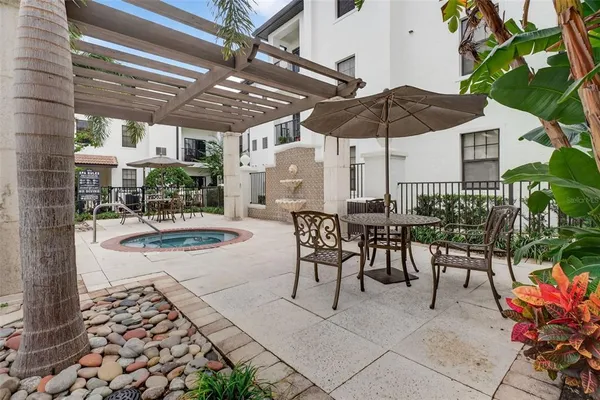 a view of a swimming pool with chairs