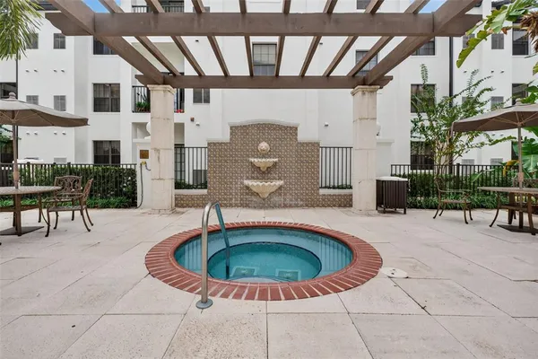 a front view of a house with a yard table and chairs
