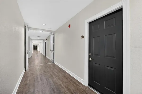 a kitchen with a cabinets and white appliances