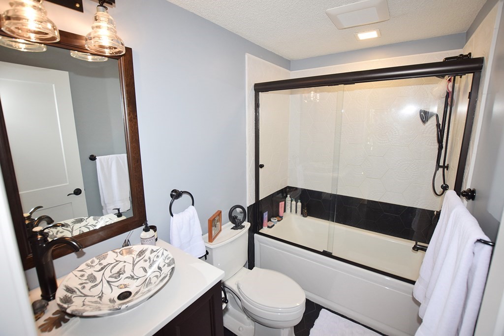 173 Hardwick Road Petersham, MA 01366 - Photo 11 of 37 a bathroom with a toilet sink and mirror
