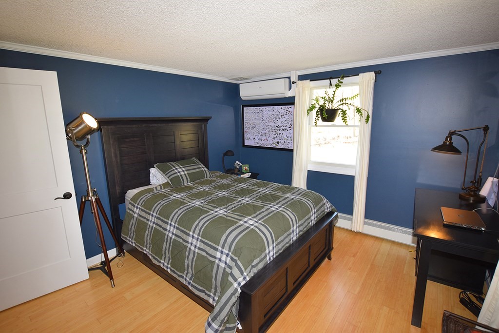 173 Hardwick Road Petersham, MA 01366 - Photo 14 of 37 a bedroom with a bed and a flat tv screen on dresser