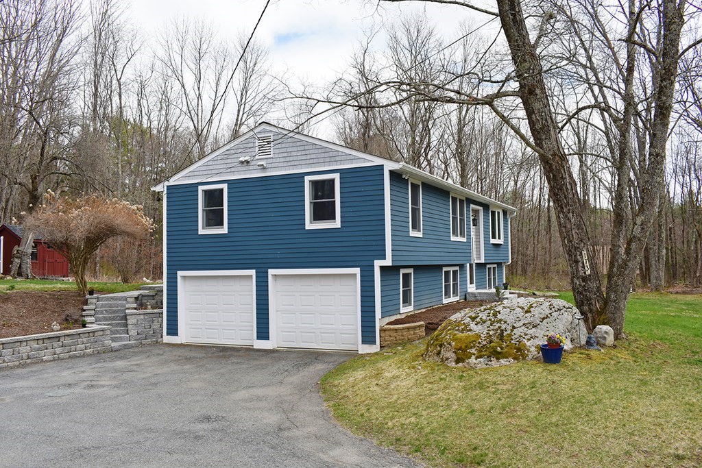 173 Hardwick Road Petersham, MA 01366 - Photo 33 of 37 a front view of a house with a yard