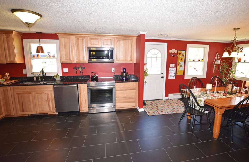 173 Hardwick Road Petersham, MA 01366 - Photo 5 of 37 a kitchen with stainless steel appliances a sink counter space and a view of living room
