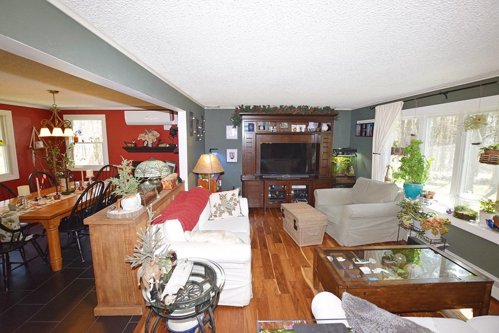 173 Hardwick Road Petersham, MA 01366 - Photo 7 of 37 a living room with furniture and a flat screen tv