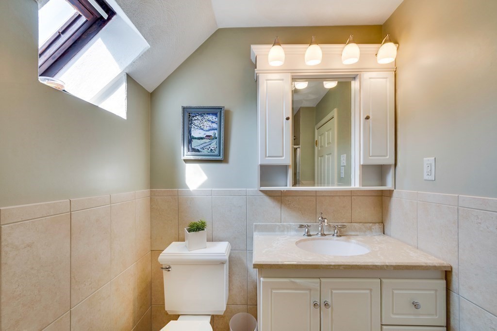 149 Andover Street, Unit 10 Andover, MA 01810 - Photo 19 of 30 a bathroom with a sink and a mirror
